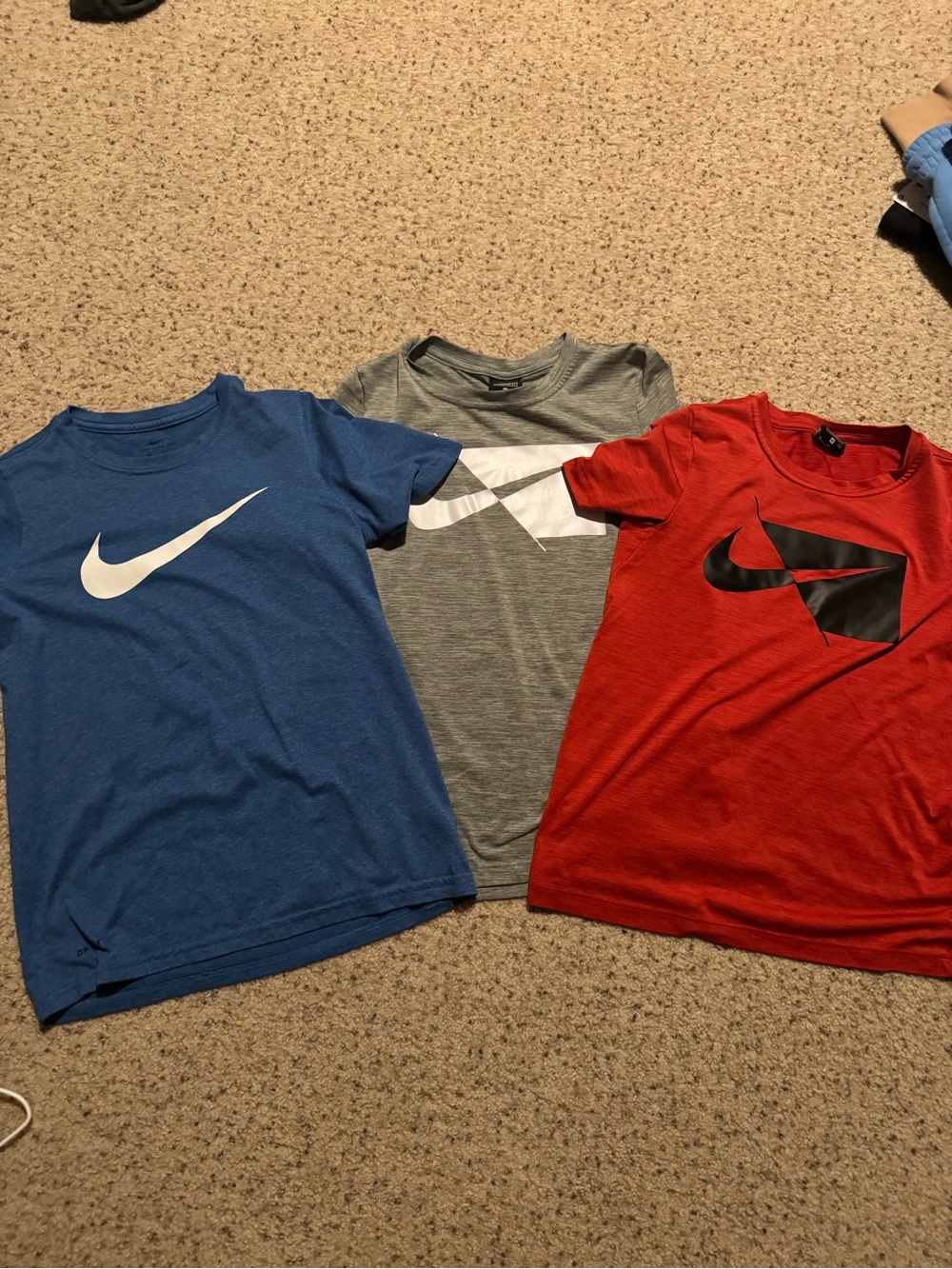 4 Nike shirts. 3 dri fit and one Cotton/teal. All mediums